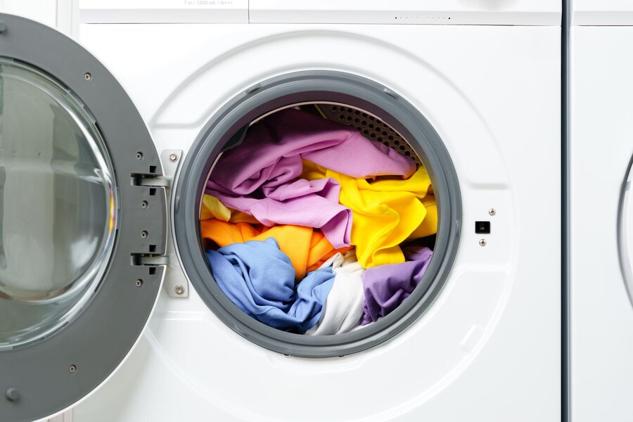 white-washing-machine-with-open-door-laundry-room_93675-246457